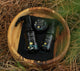 Set of 'true' skincare products in a wooden bowl on a natural background